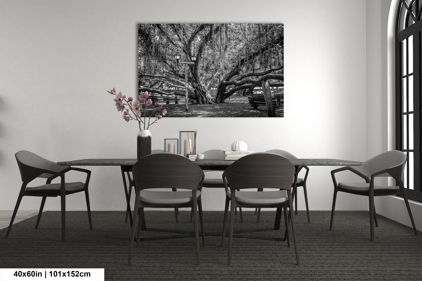 a black and white photo of a dining room table