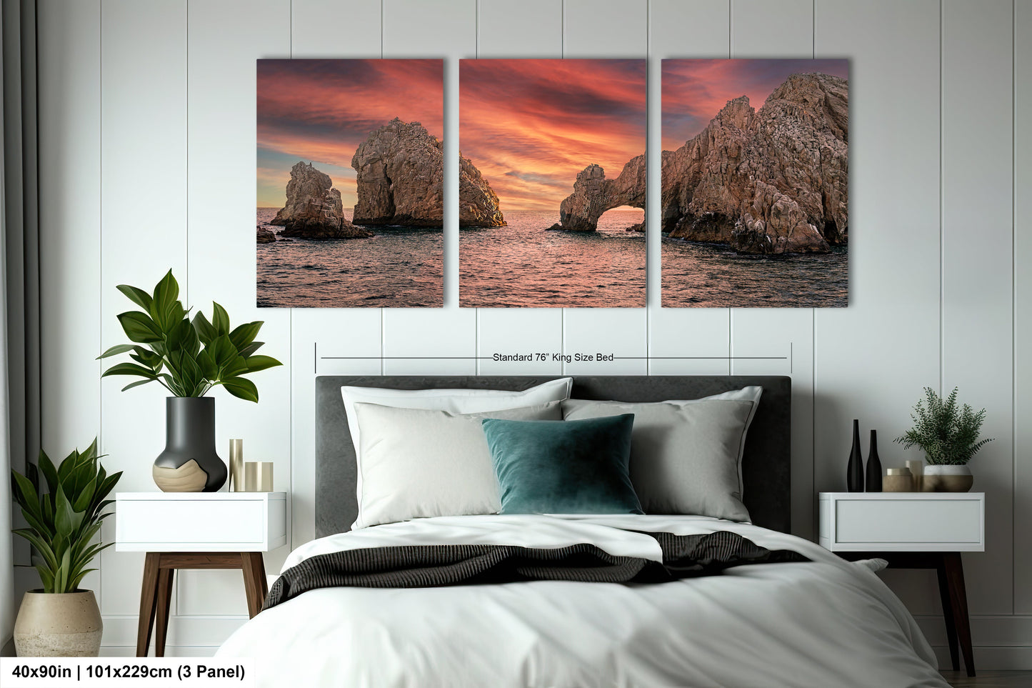 a bedroom with a bed and two pictures on the wall