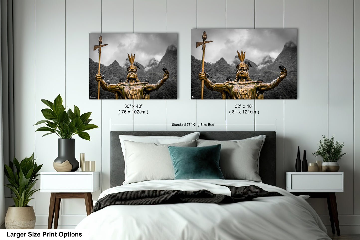 a bed with two pictures on the wall above it