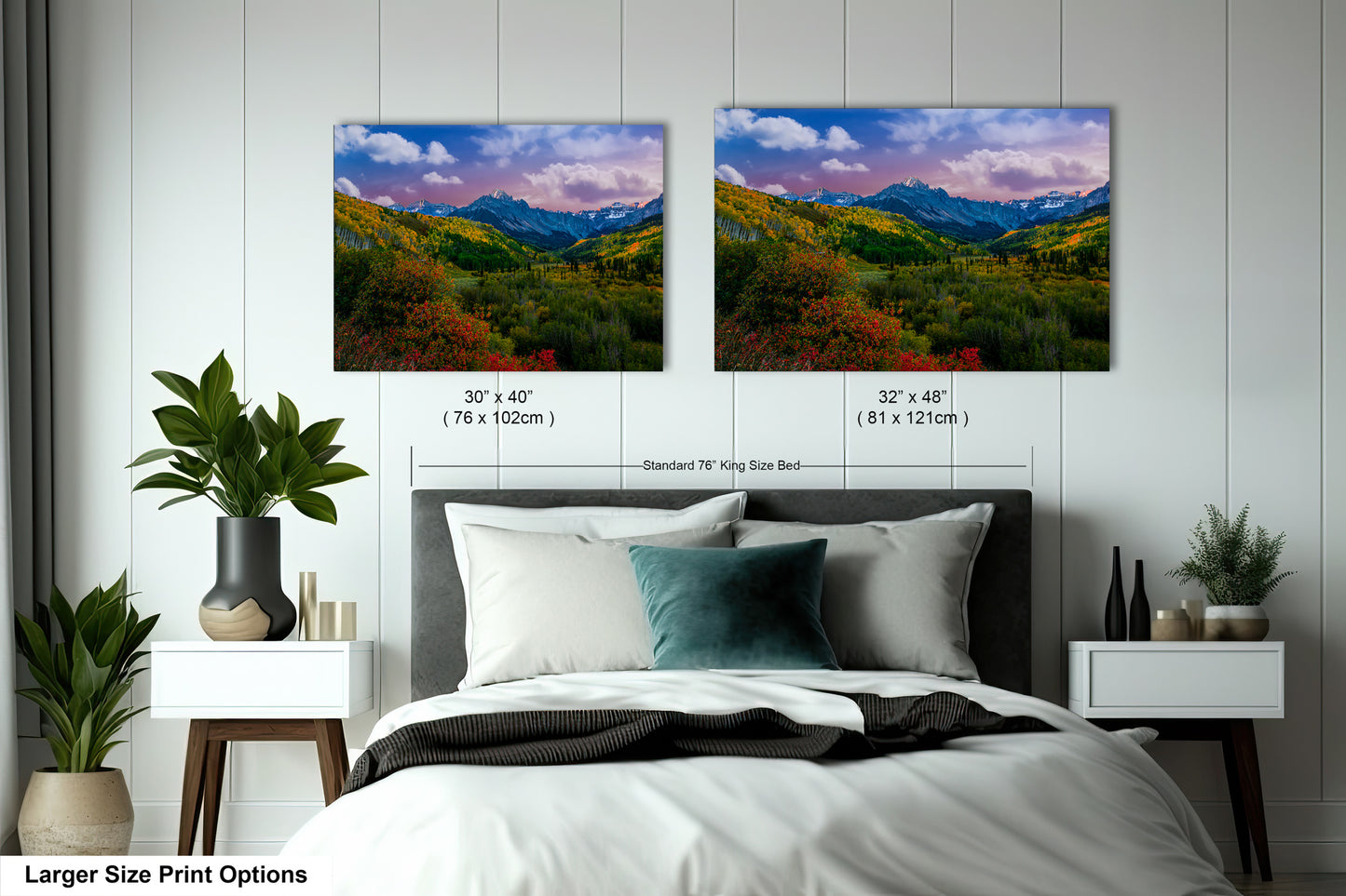 a bedroom with a bed and two pictures on the wall