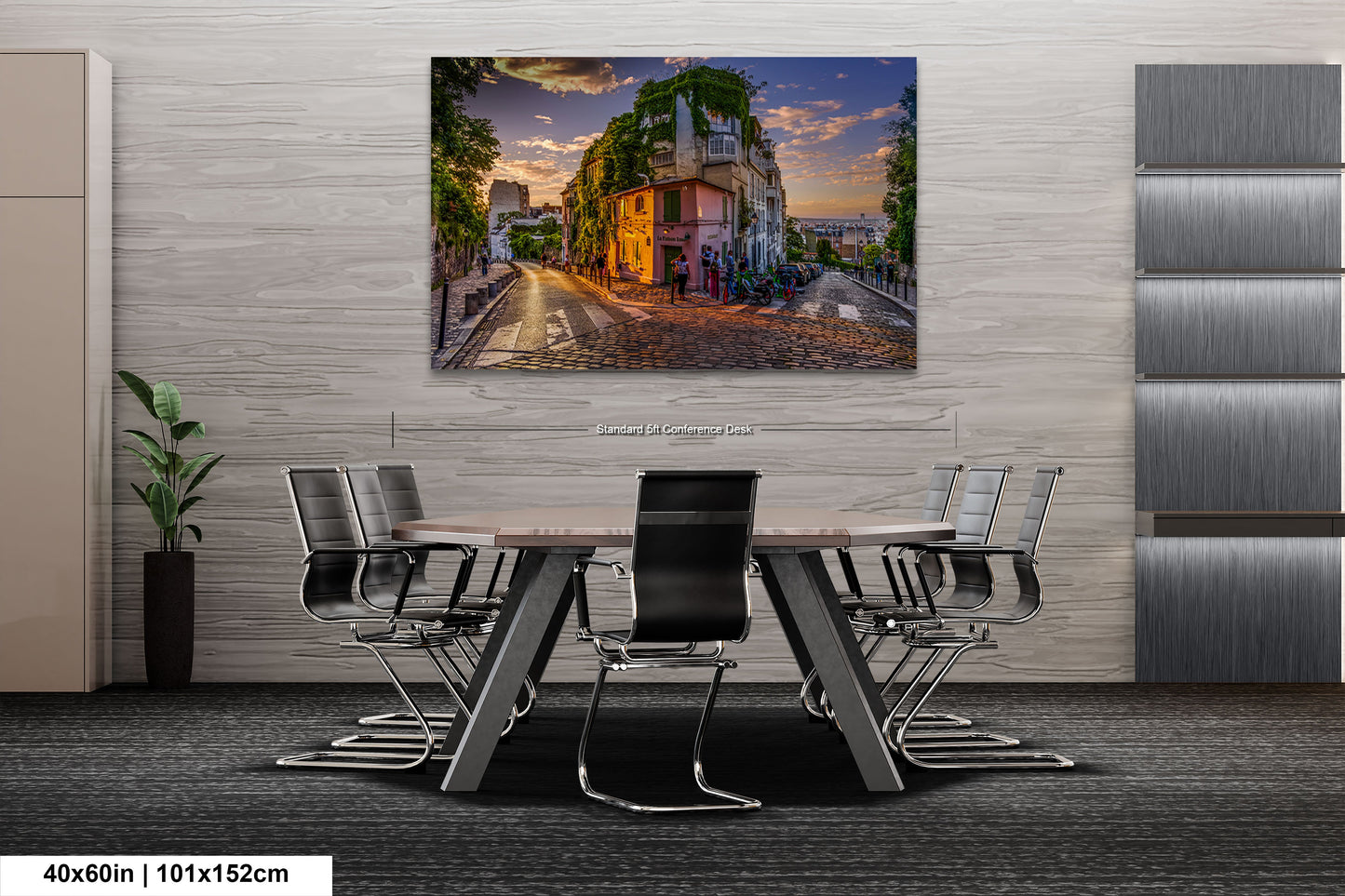 a dining room table with chairs and a painting on the wall