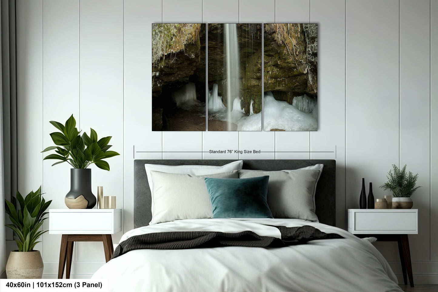 a bed with a white comforter and two paintings on the wall