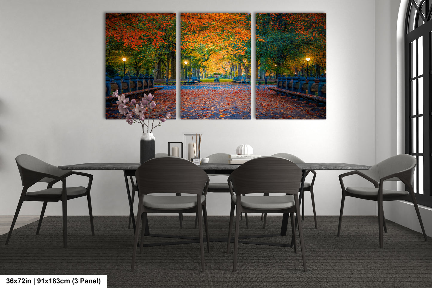 a dining room table with four chairs and a painting on the wall