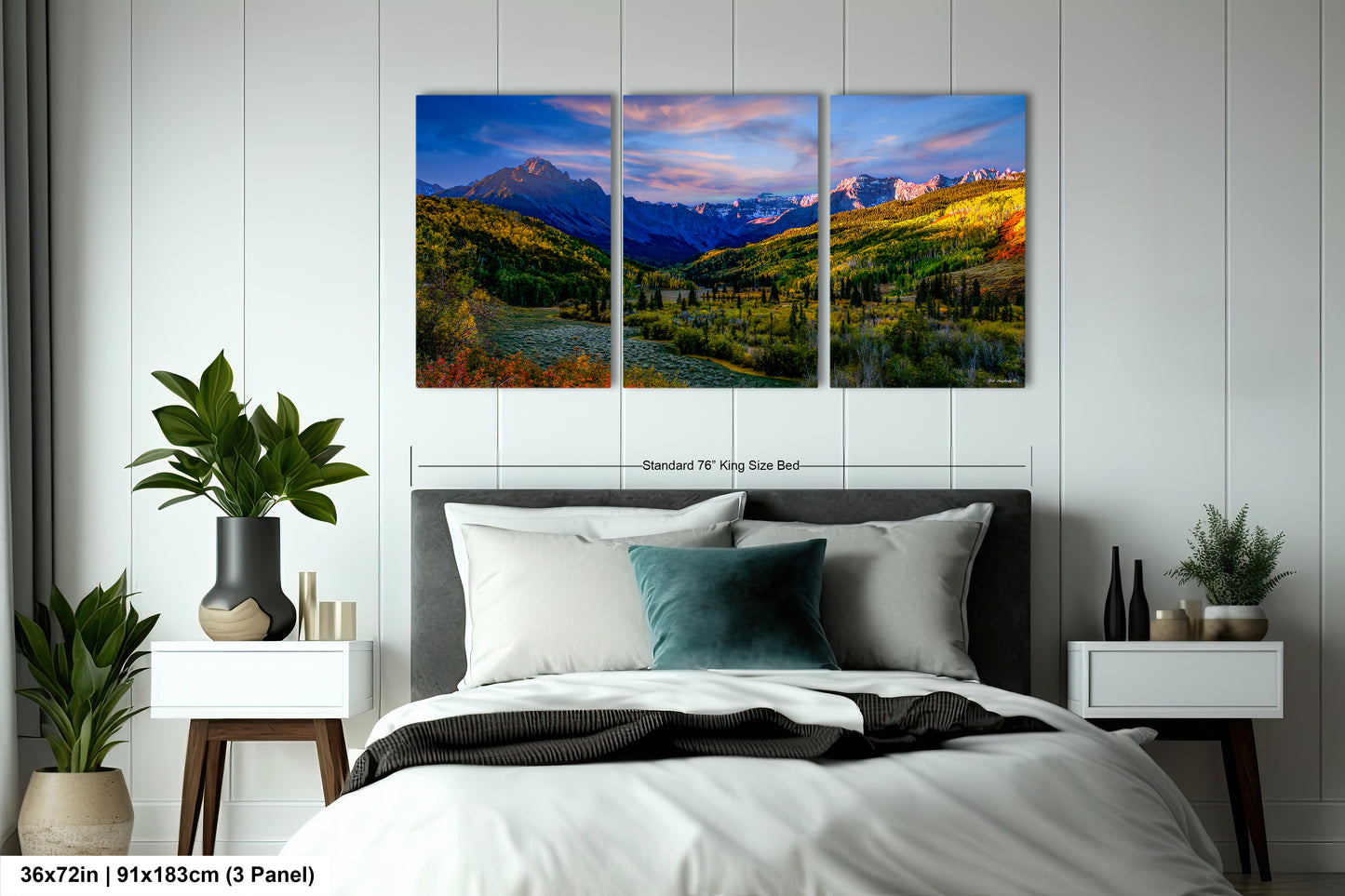 a bedroom scene with a bed and two paintings on the wall
