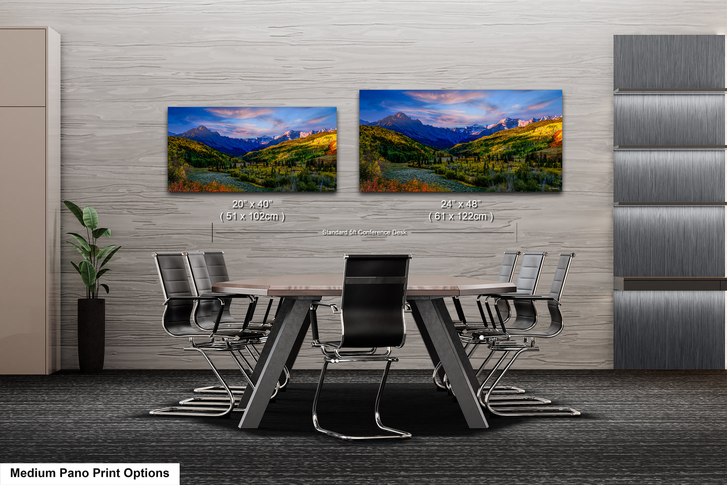 a dining room table with chairs and a painting on the wall