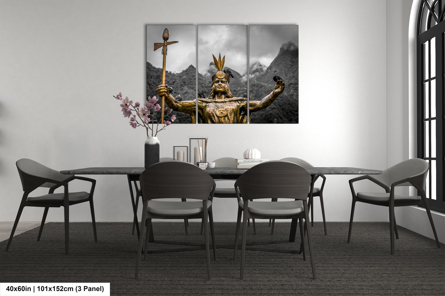 a dining room table with chairs and a painting on the wall