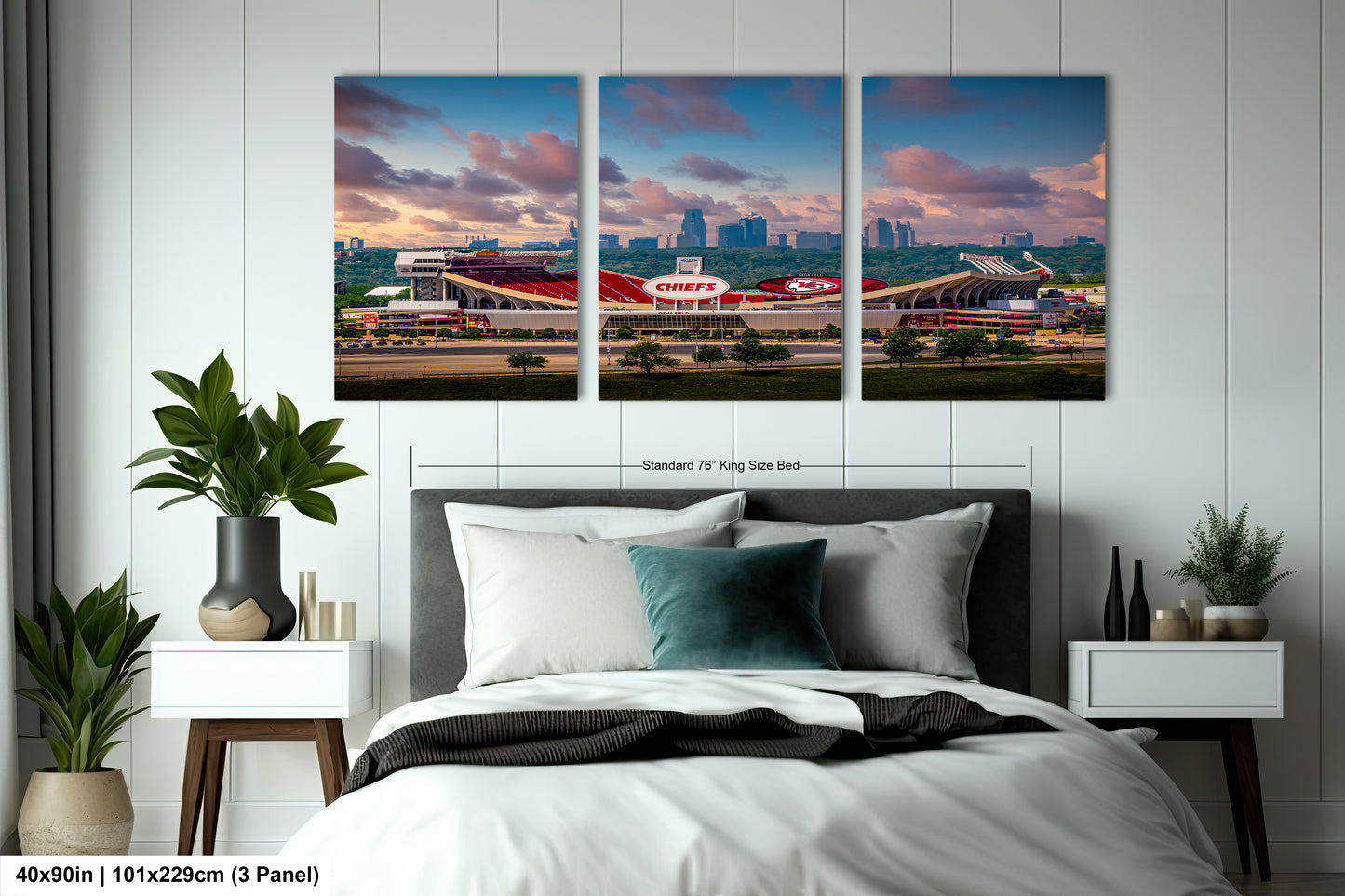 a bedroom with a large bed and three paintings on the wall