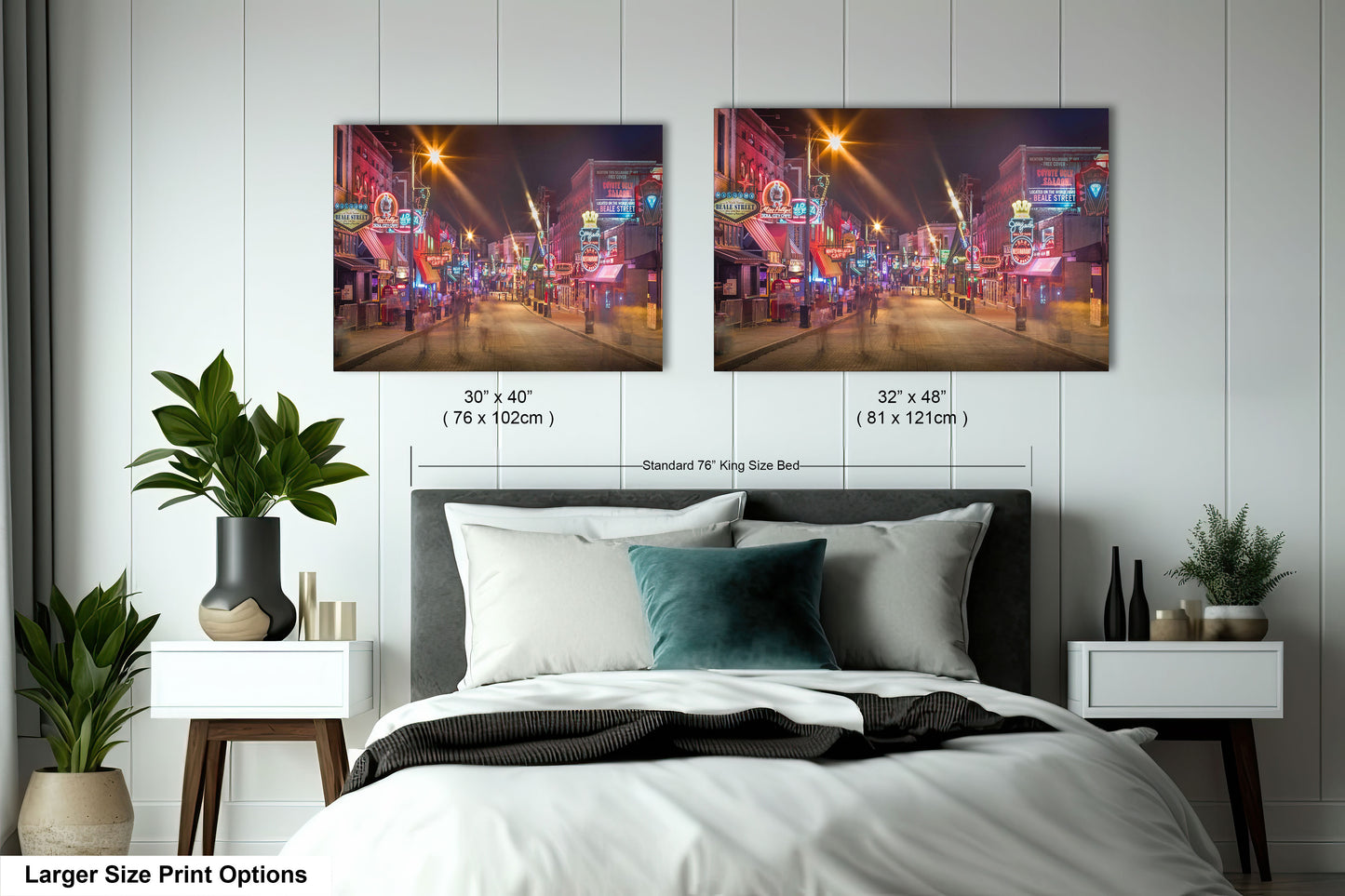 a bedroom with a bed and two pictures on the wall