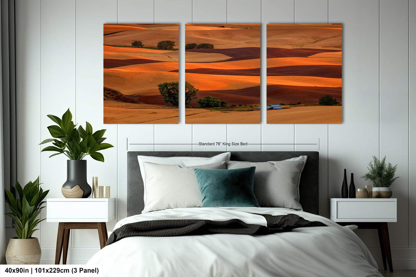 a bed room with a neatly made bed and two paintings on the wall