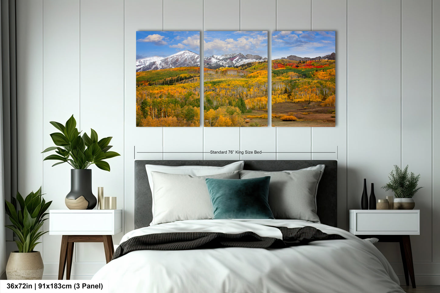a bed room with a neatly made bed and two paintings on the wall