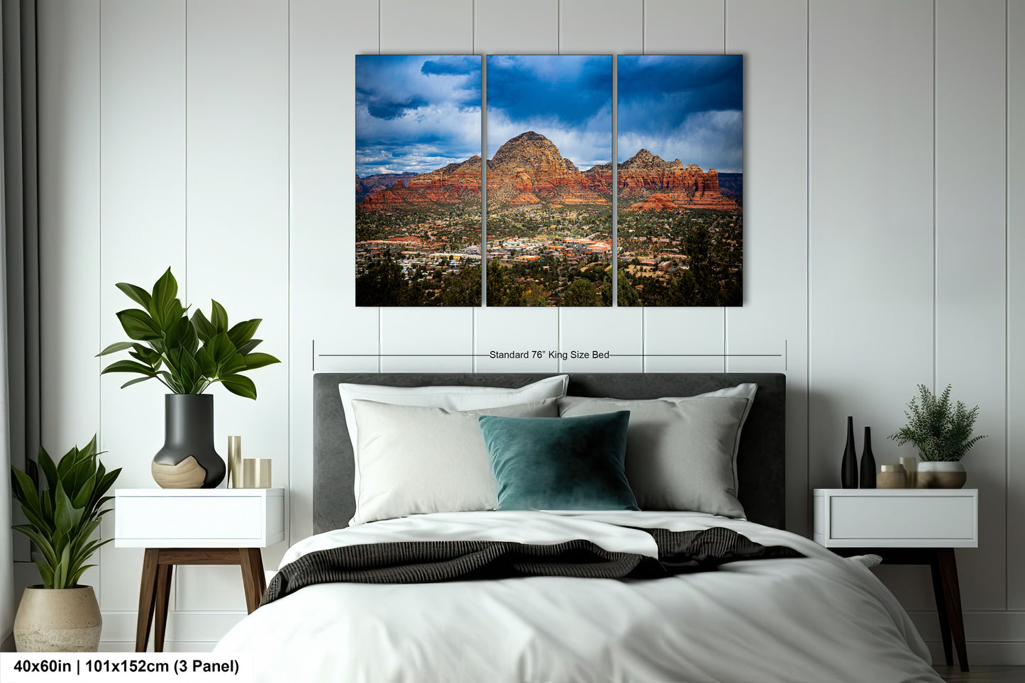 a bed room with a neatly made bed and a painting on the wall