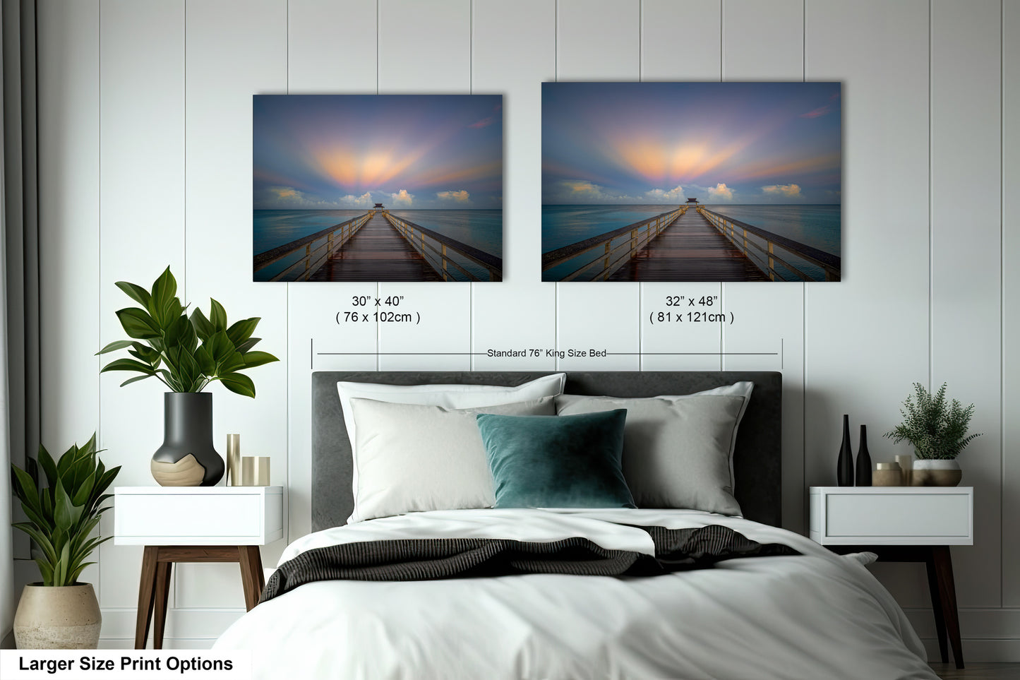 a bedroom with a bed and two pictures on the wall