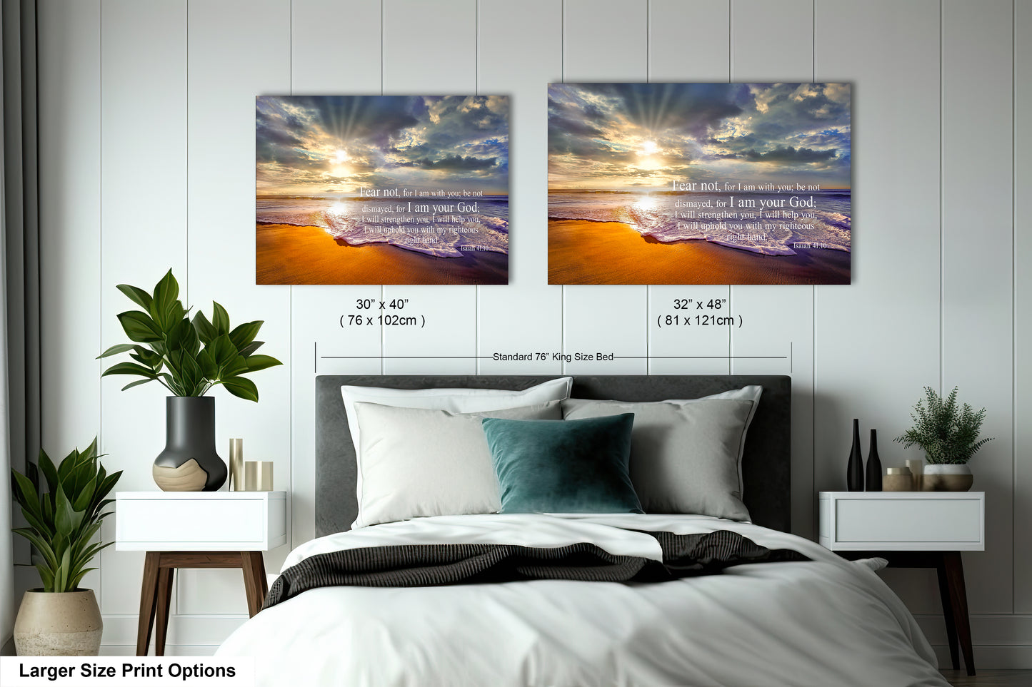 a bed with two pictures on the wall above it