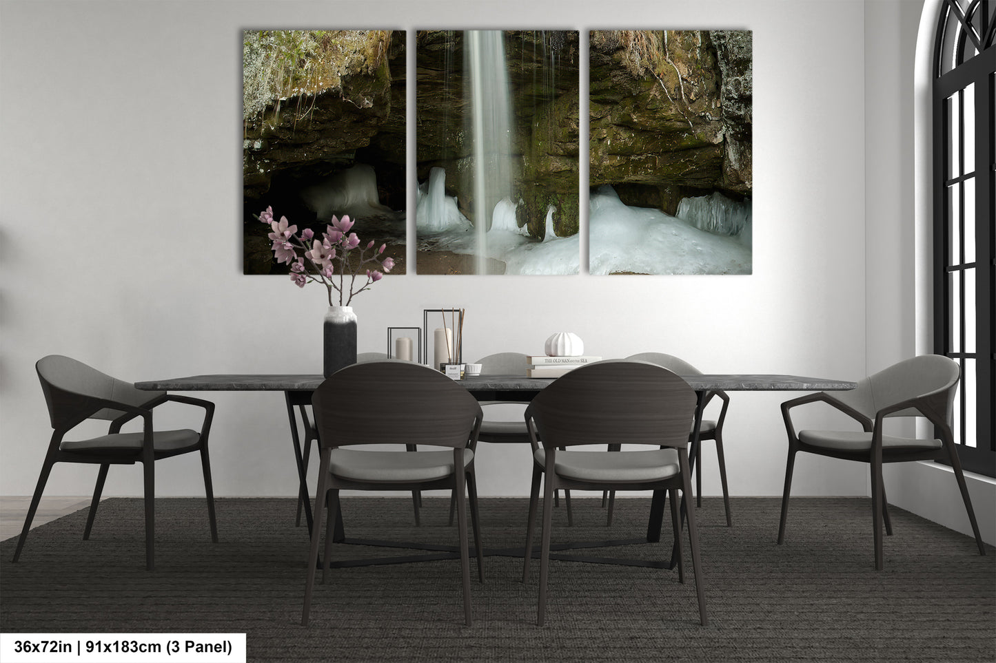 a dining room table with four chairs and a waterfall in the background
