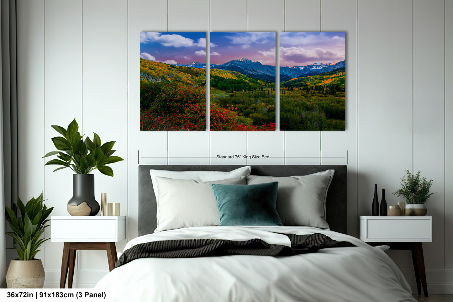 a bedroom with a bed and two paintings on the wall