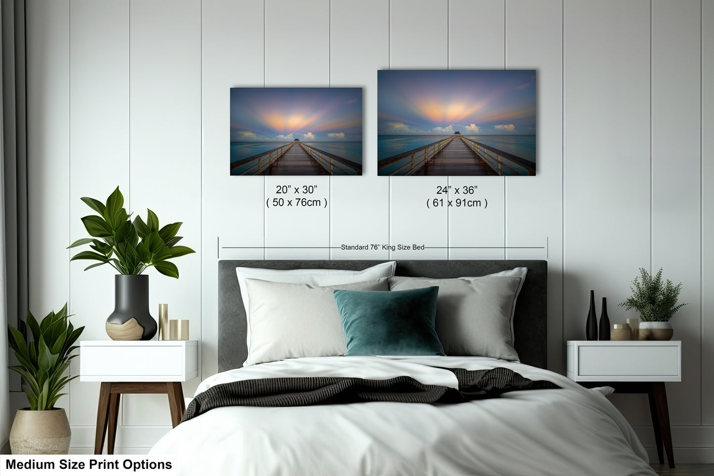 a bedroom with a bed and two pictures on the wall