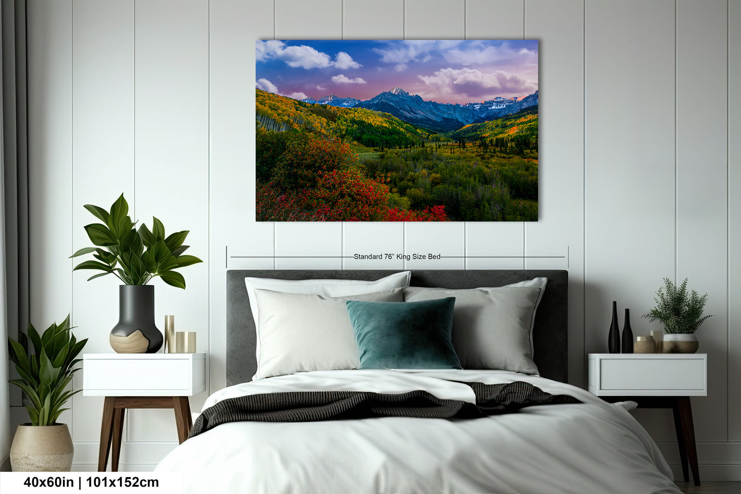 a bedroom with a bed and a painting on the wall