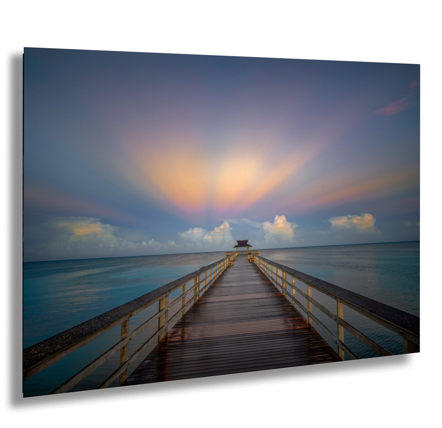 a long pier stretching out into the ocean