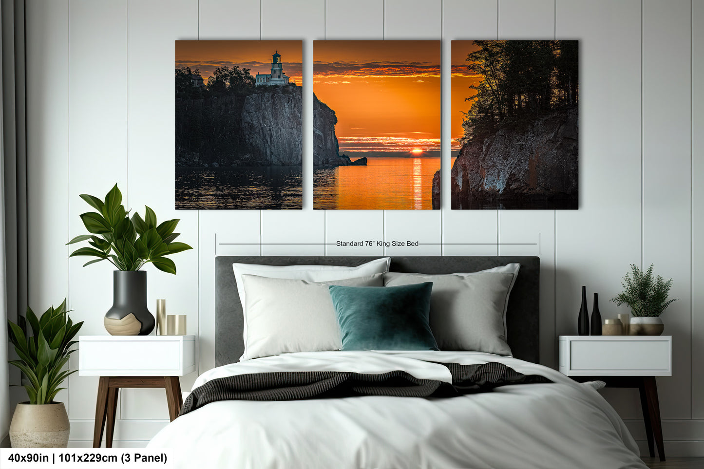 a bedroom with a bed and two paintings on the wall