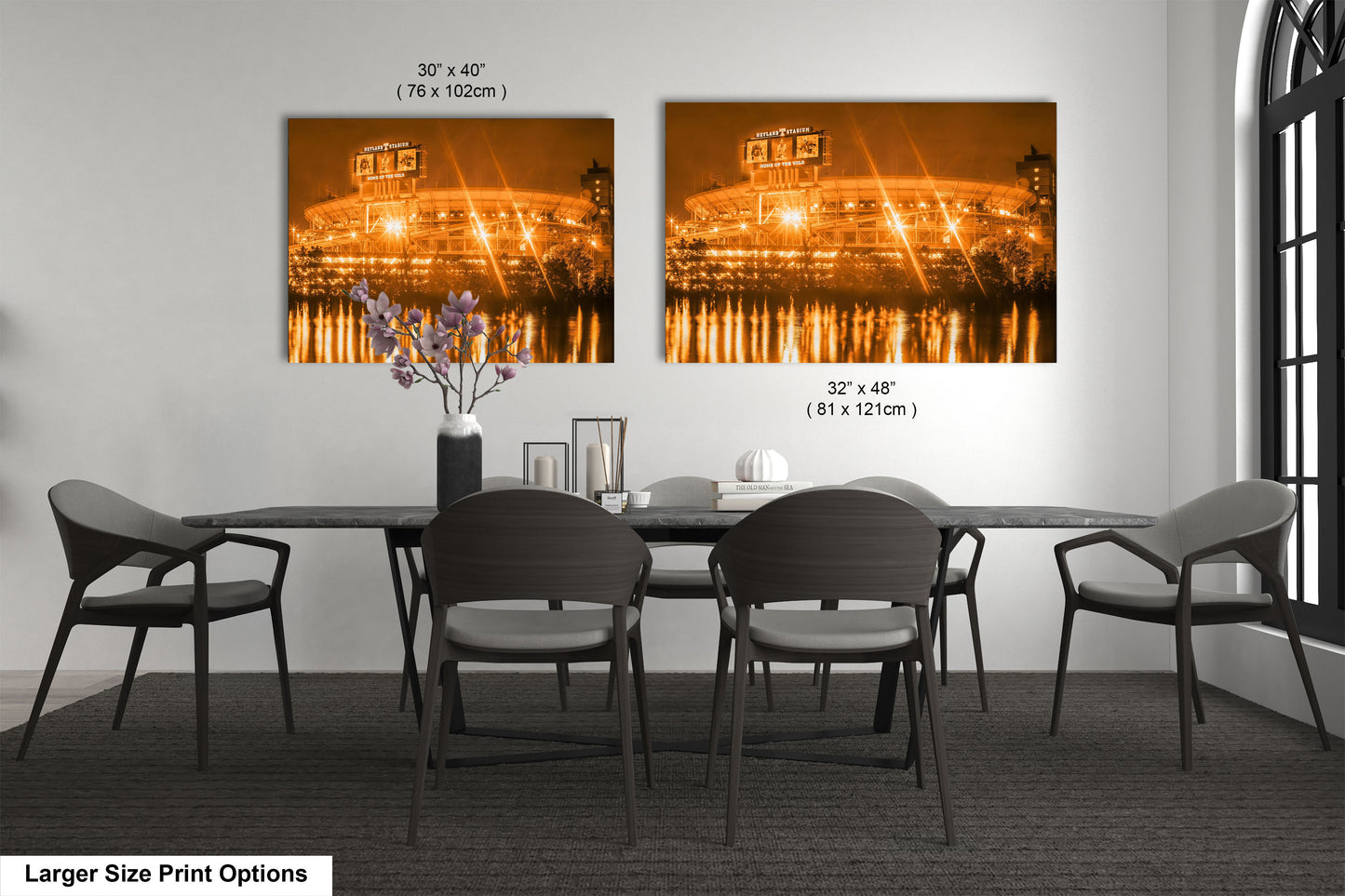 a dining room table with four chairs and a vase of flowers