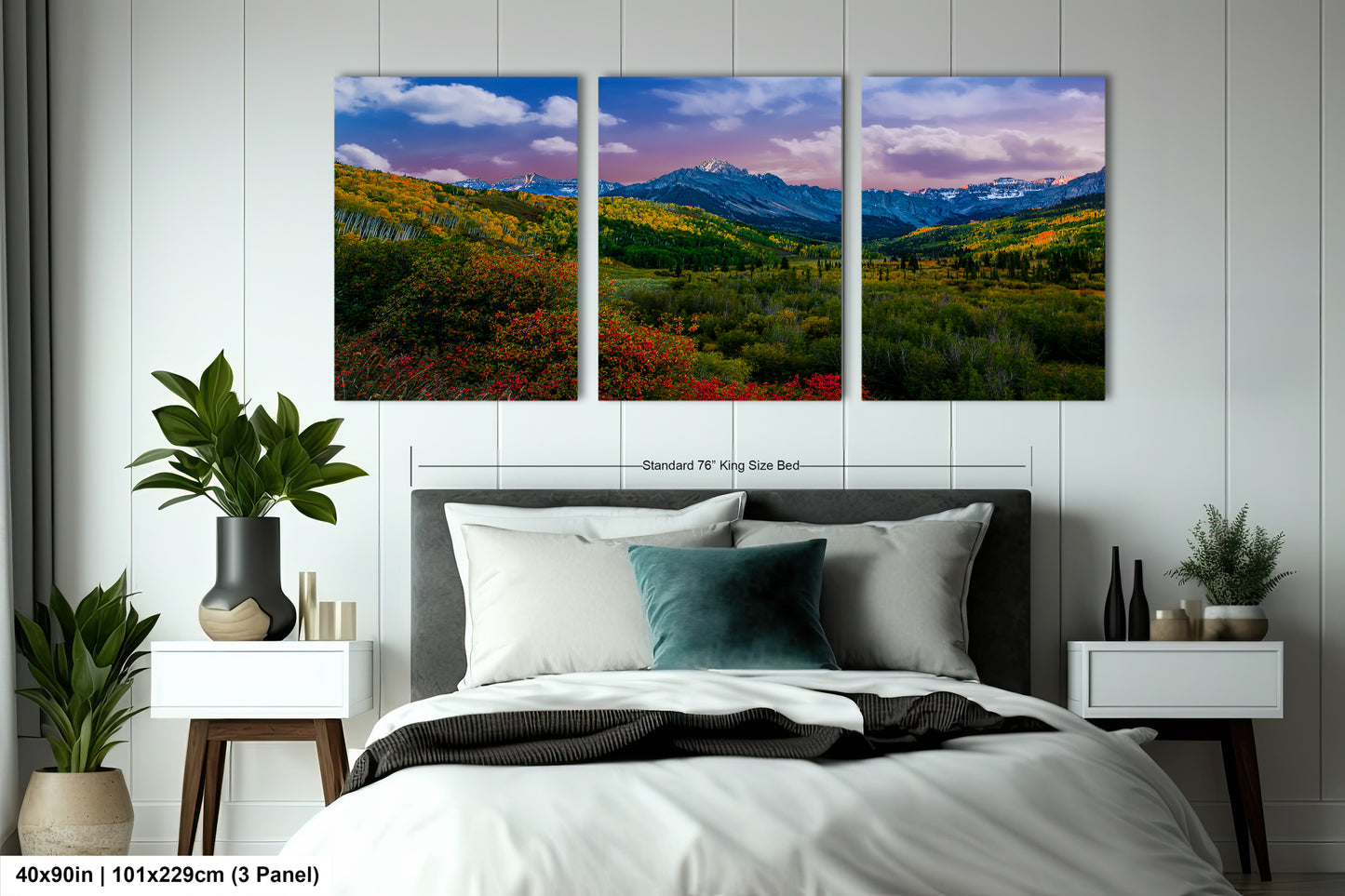 a bedroom scene with a bed and two paintings on the wall