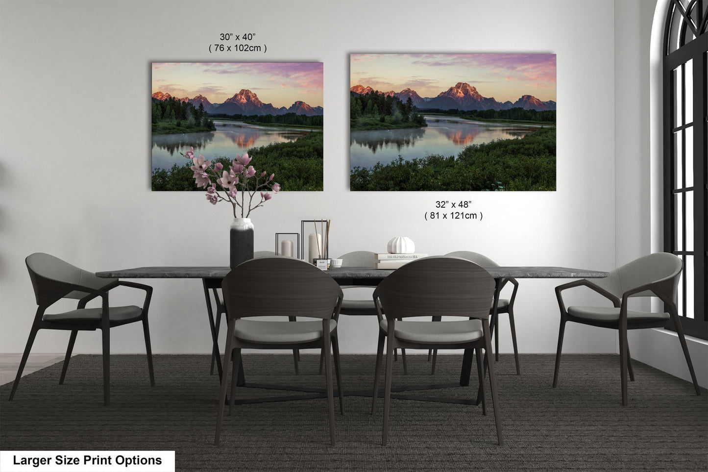 a dining table with four chairs and a vase of flowers