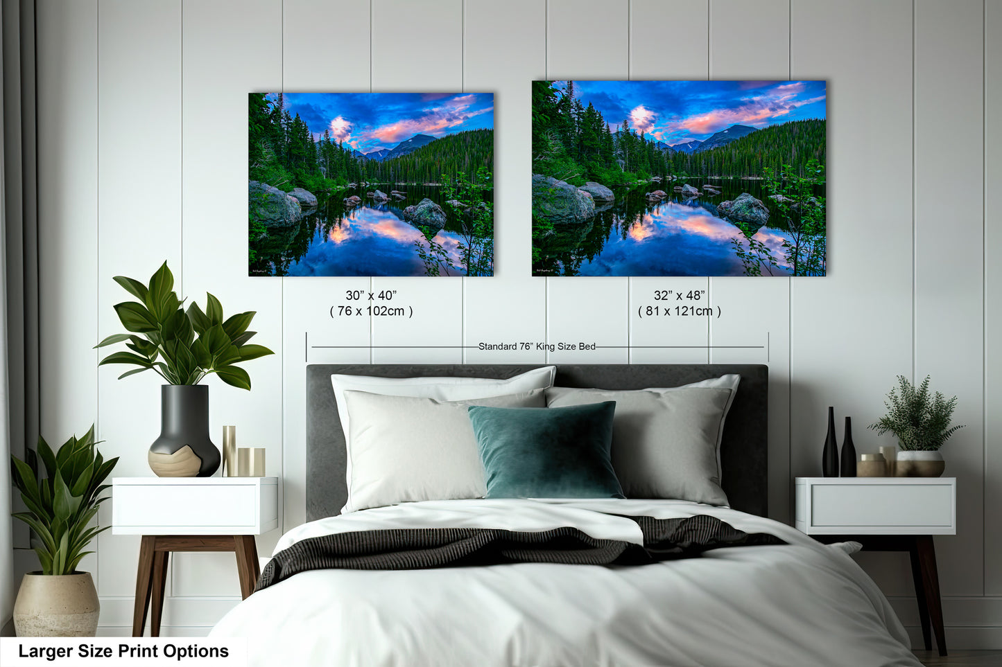 a bedroom with a bed and two pictures on the wall