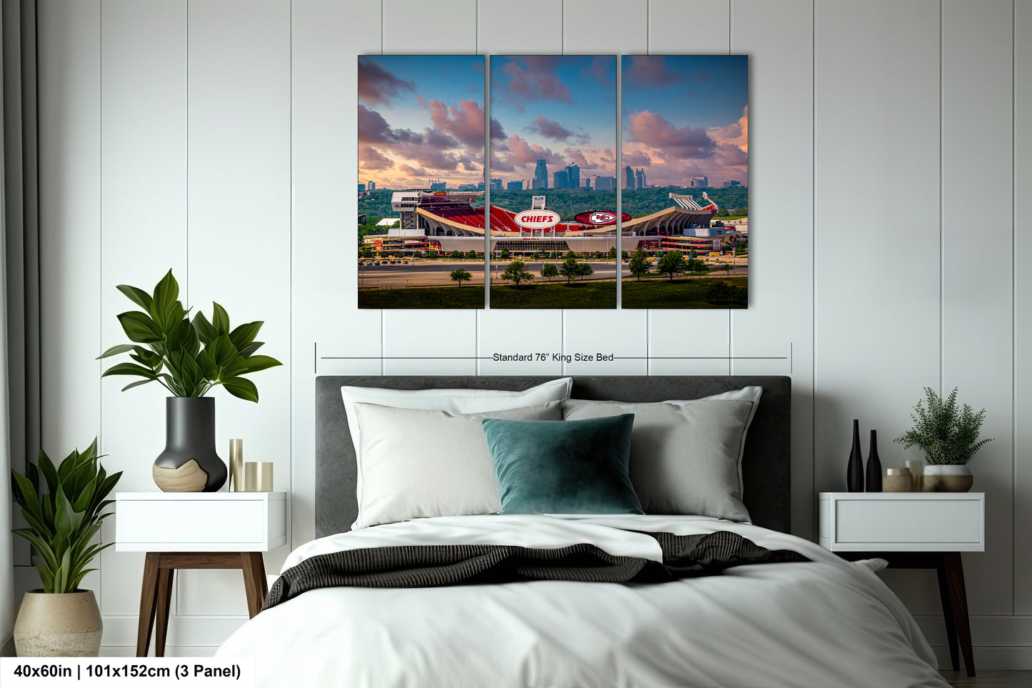 a bedroom with a large bed and a picture on the wall