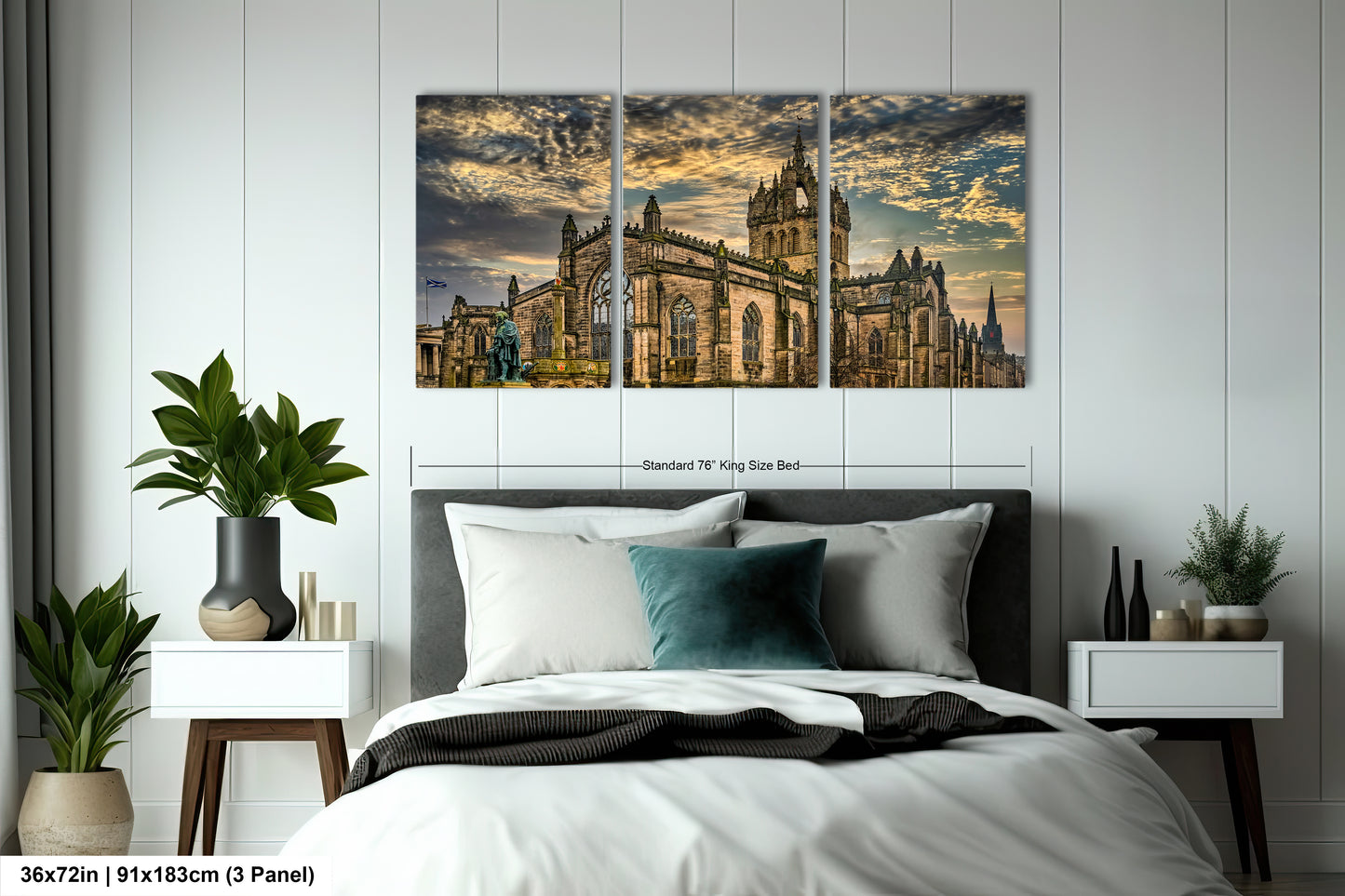 a bedroom with a large bed and two paintings on the wall