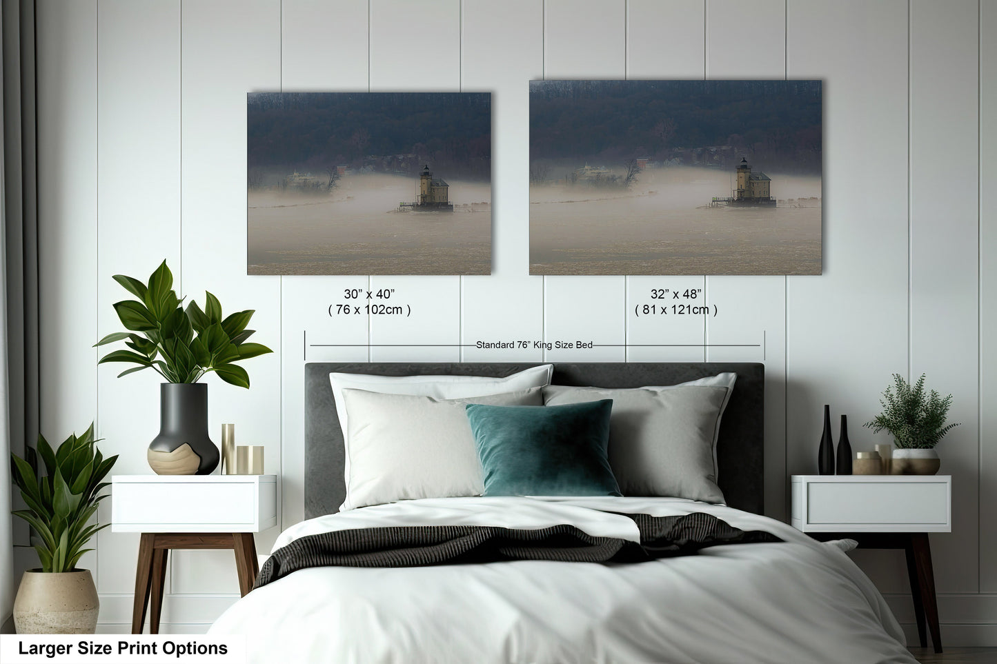 a bed with two pictures on the wall above it