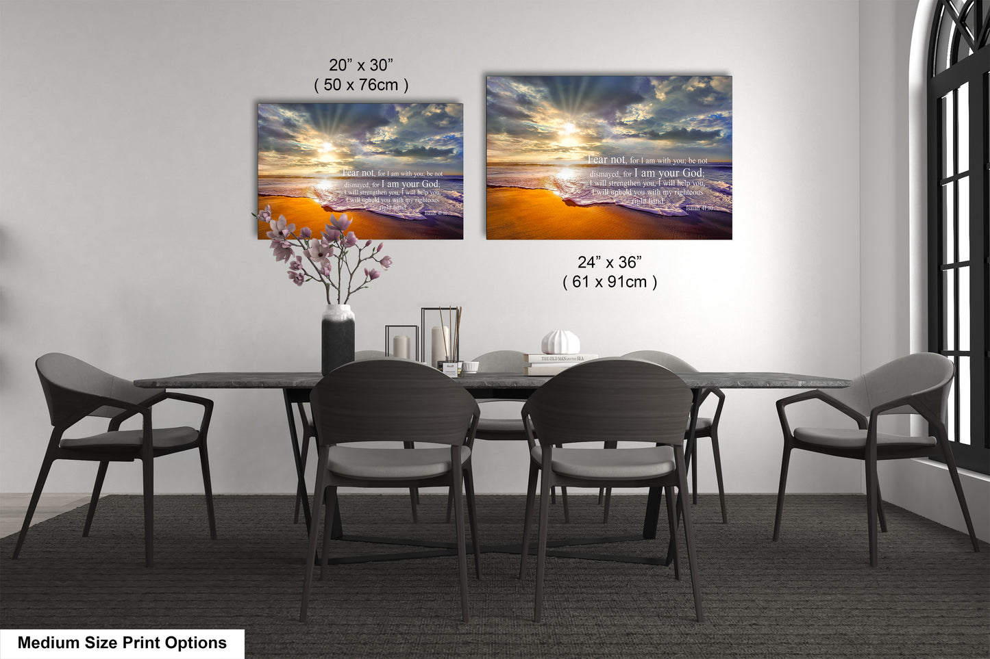 a dining room table with four chairs and a vase of flowers