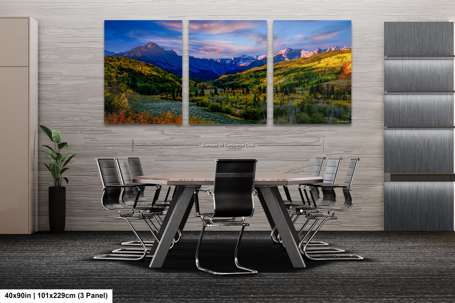 a dining room table with chairs and a painting on the wall