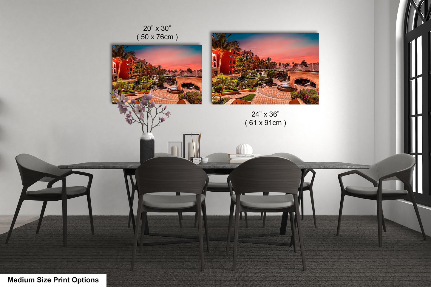 a dining room table with chairs and a vase of flowers