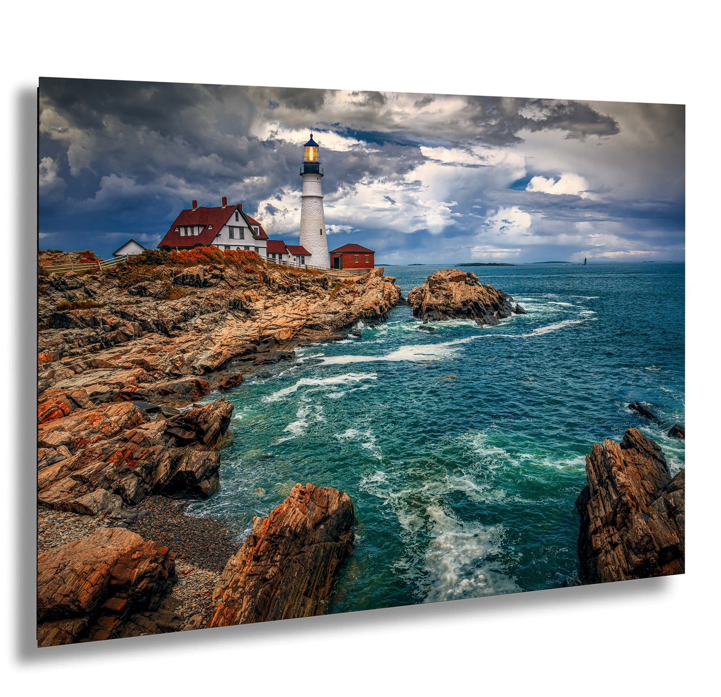 a picture of a lighthouse on a rocky shore
