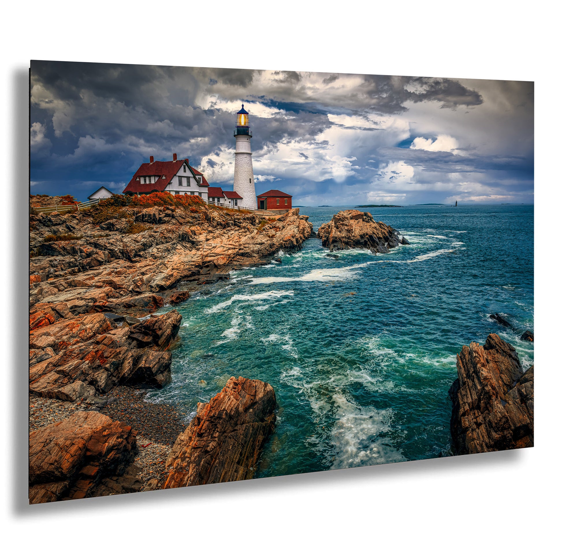 a picture of a lighthouse on a rocky shore