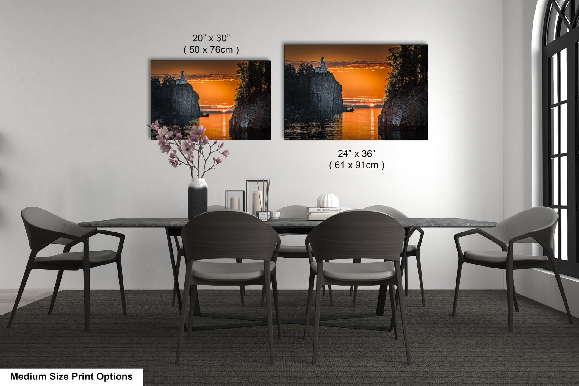 a dining table with four chairs and a vase of flowers