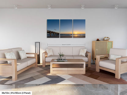 a living room filled with furniture and a painting on the wall