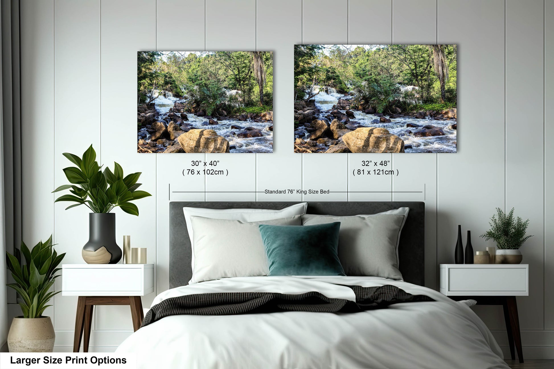 a bed with two pictures on the wall above it