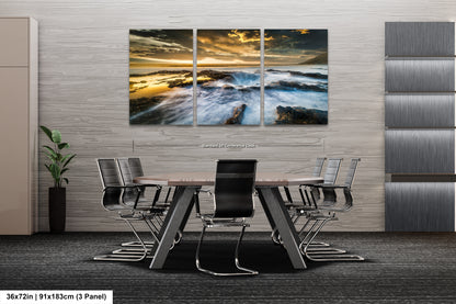 a dining room table with chairs and a painting on the wall
