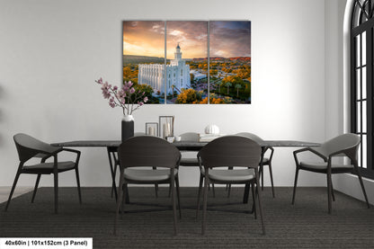 a dining room table with chairs and a painting on the wall