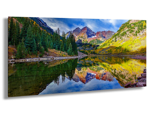 a lake surrounded by mountains and trees