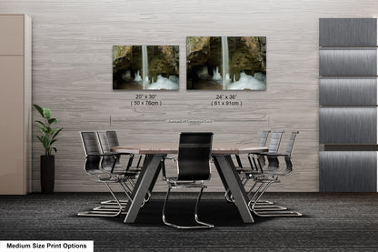 a dining room table with chairs and a waterfall in the background