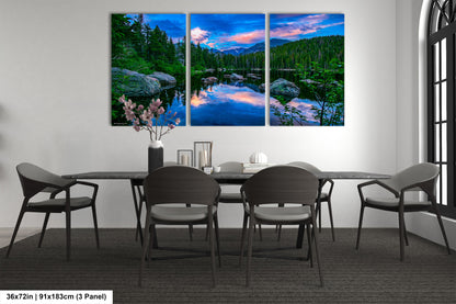a dining room table with chairs and a painting on the wall