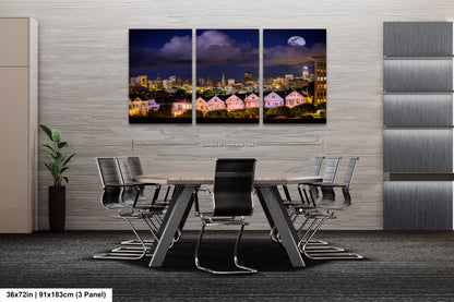 a dining room table with a view of a city at night