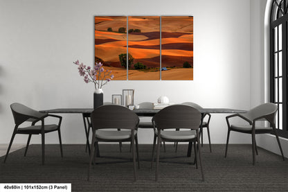 a dining room table with four chairs and a painting on the wall