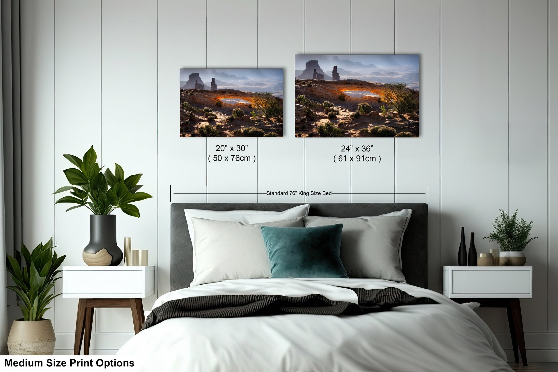 a bed with two pictures on the wall above it