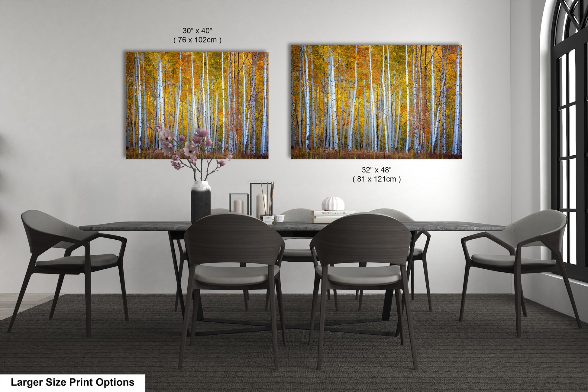 a dining room table with chairs and a painting on the wall