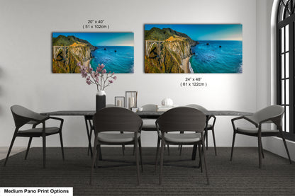 a dining room table with four chairs and a painting on the wall