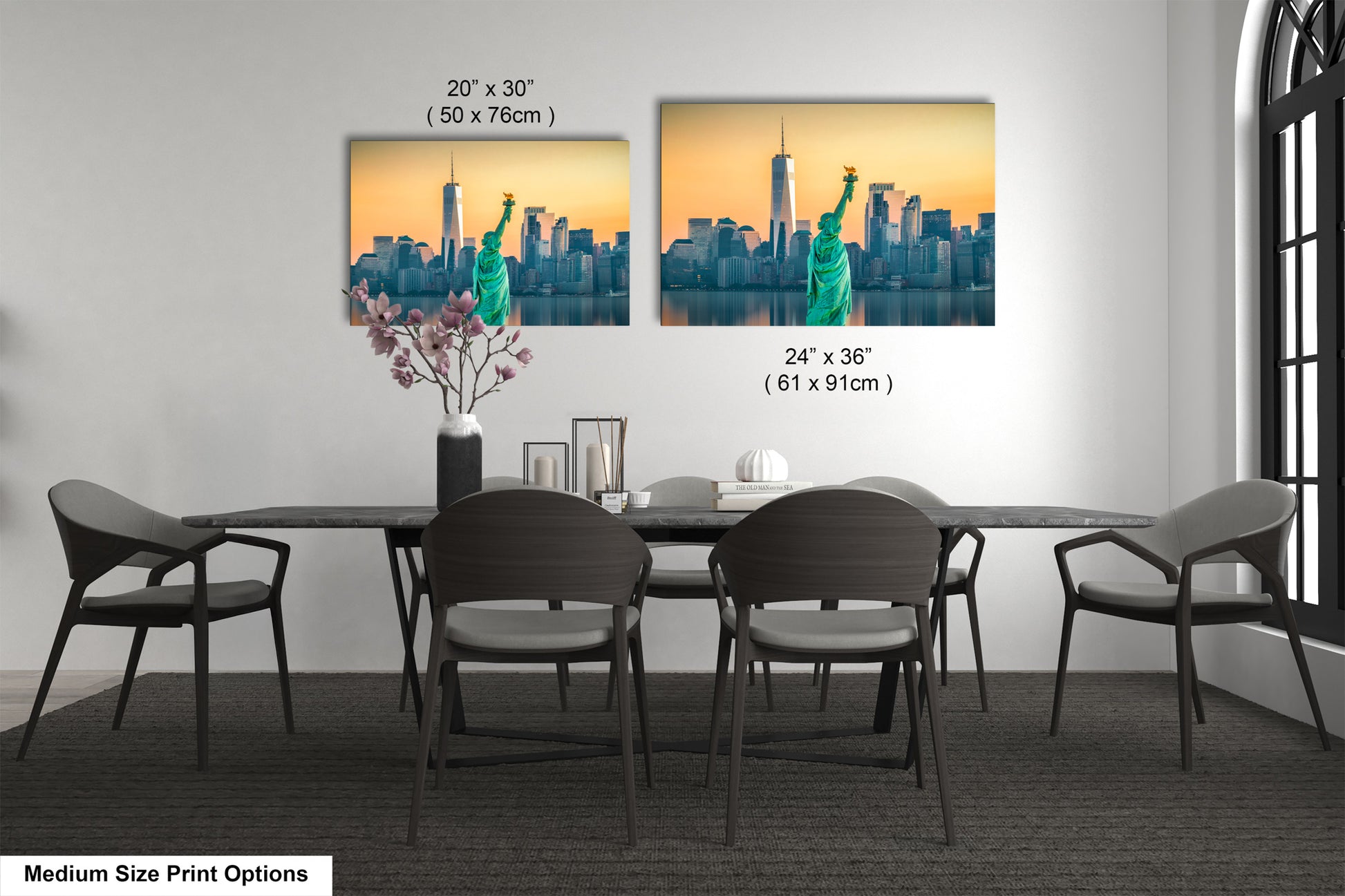 a dining room table with four chairs and a vase of flowers