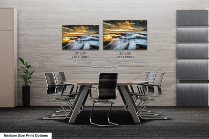 a dining room table with four chairs and two pictures on the wall